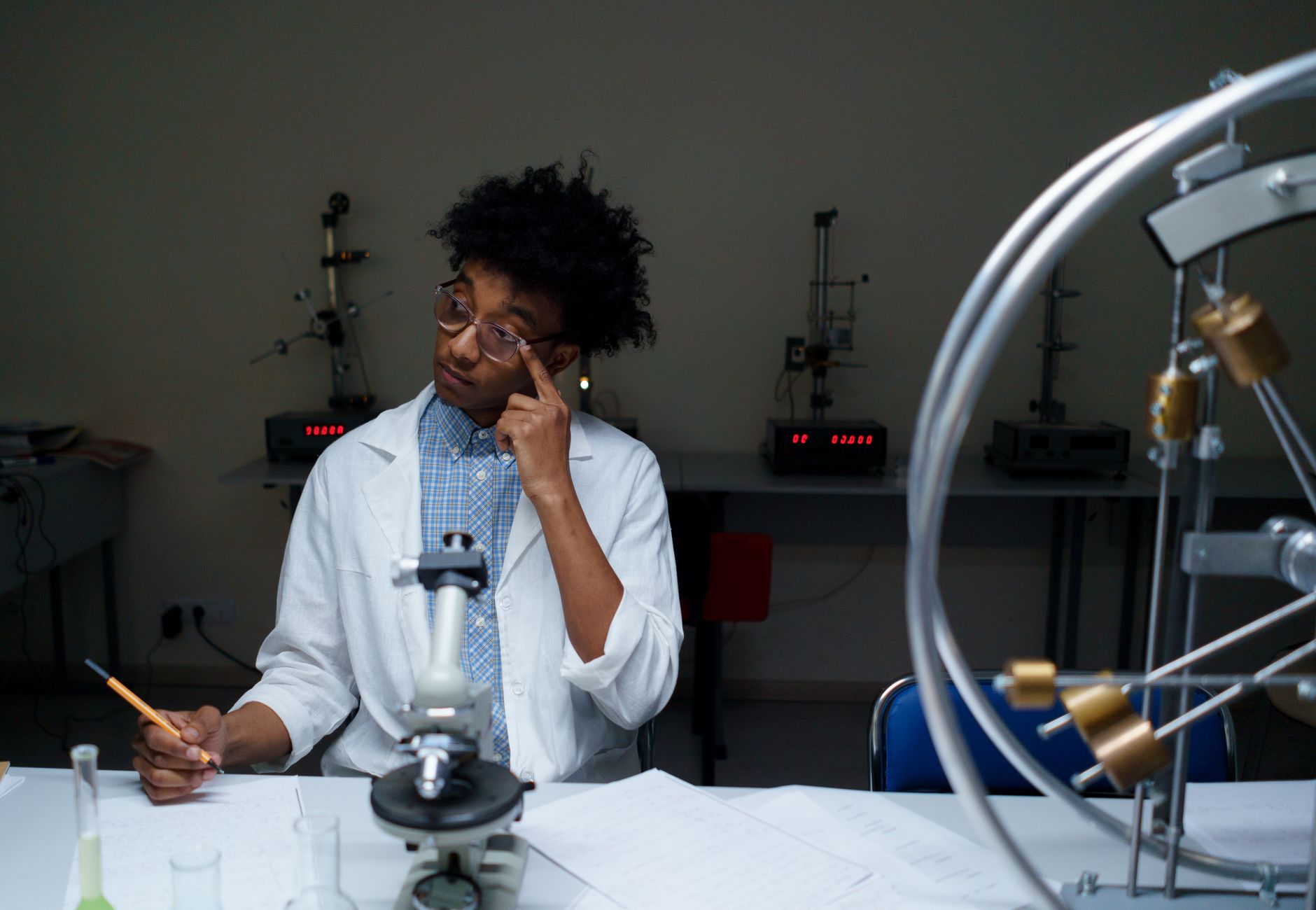 A young adult conducting scientific research in a modern laboratory setting.